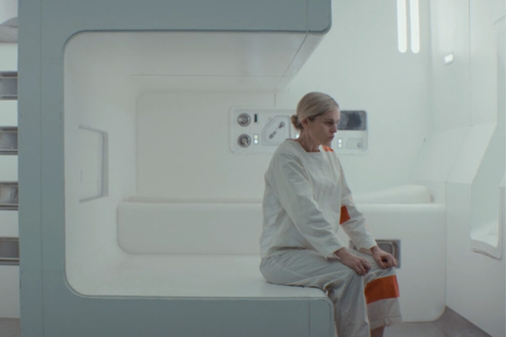 A dejected Dedra Meero wearing a uniform in a cell at an Imperial prison camp in the season finale of Andor. (Disney / Lucasfilm)