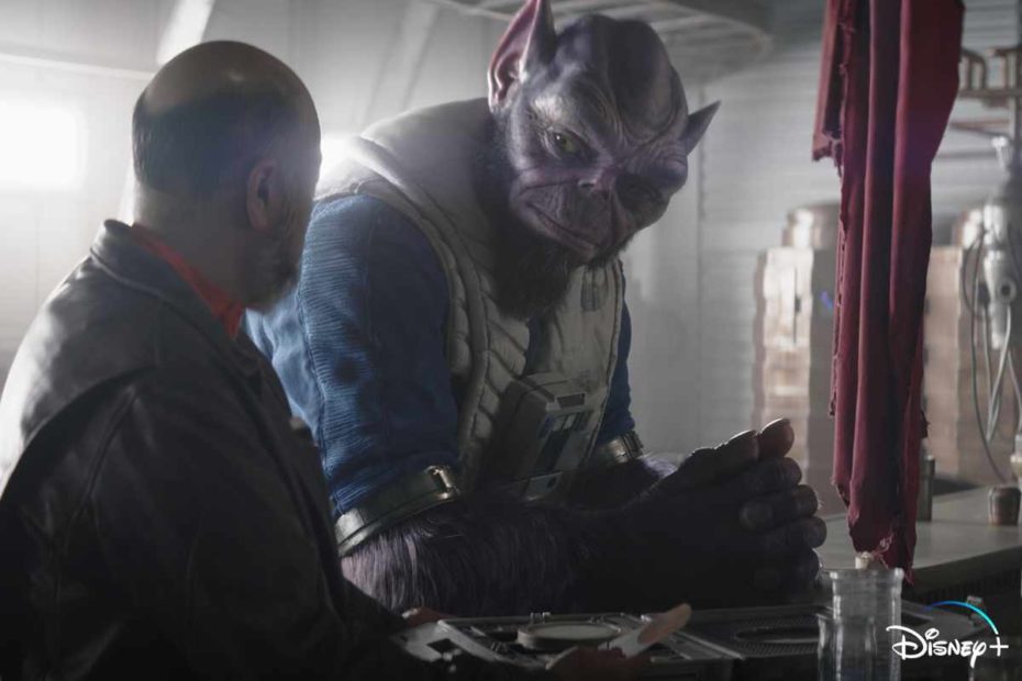 Captain Carson Teva talks with fellow New Republic pilot Zeb Orrelios in a bar during The Mandalorian episode "Chapter 21: The Pirate." This episode marks Zeb’s first live-action appearance in Star Wars. (Disney / Lucasfilm)