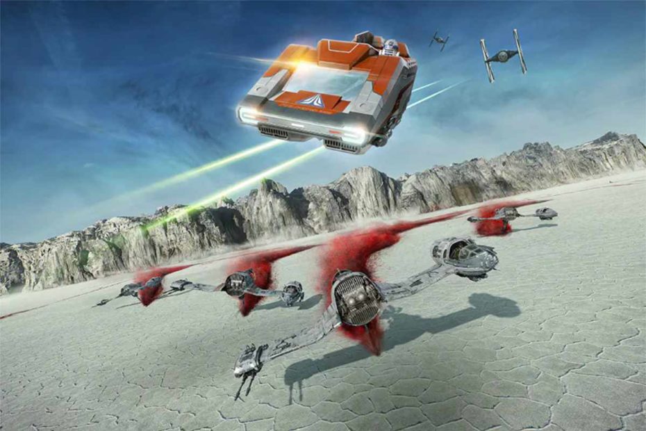 In a promotional photo for The Last Jedi update of Star Tours, a StarSpeeder 1000 flies over ski speeders speeding along the salt flats on the surface of Crait. (Disney / Lucasfilm)